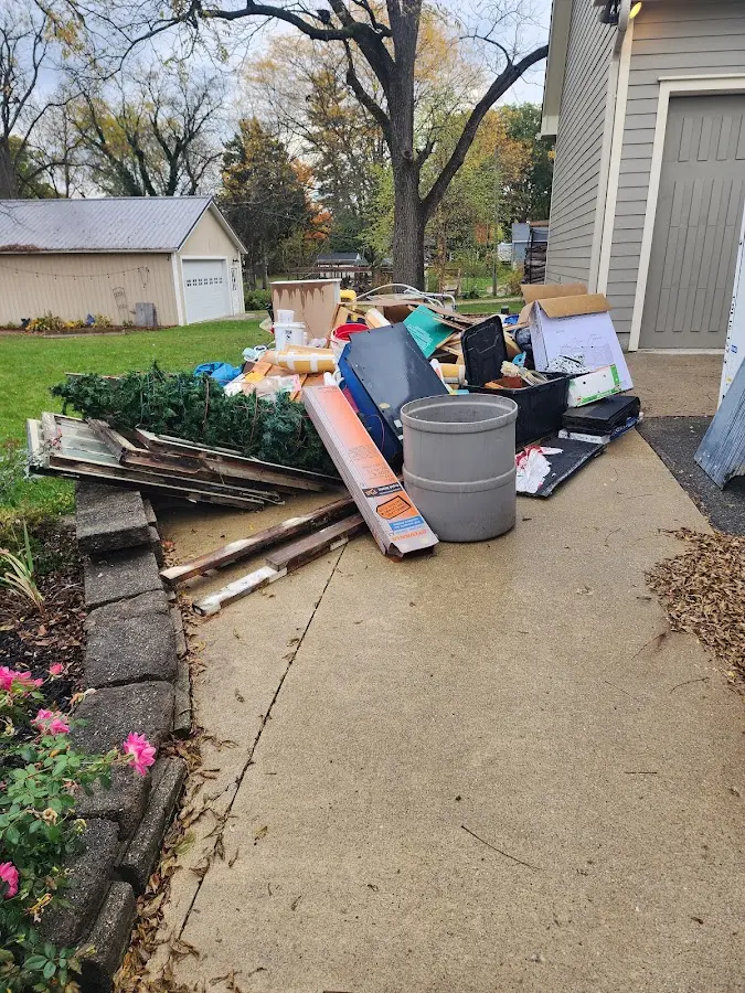 Dumpster being loaded with debris for 3 Yard Dumpster Rental in Marple